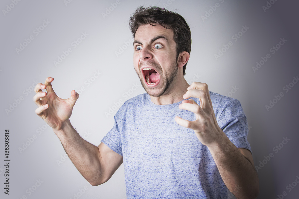 Angry man yelling and shouting in rage, crazy and mad Stock-Foto - Raging Bull Casino $75 Free Chip