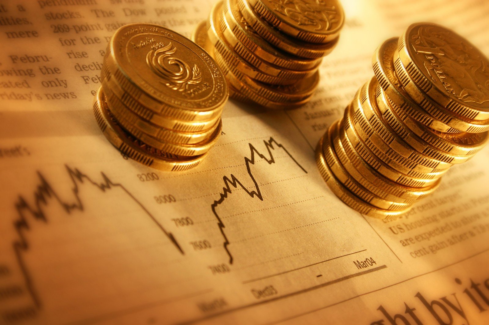 Gold coins on financial newspaper depicting market trends Free Stock - Financial Center Credit Union Customer Service