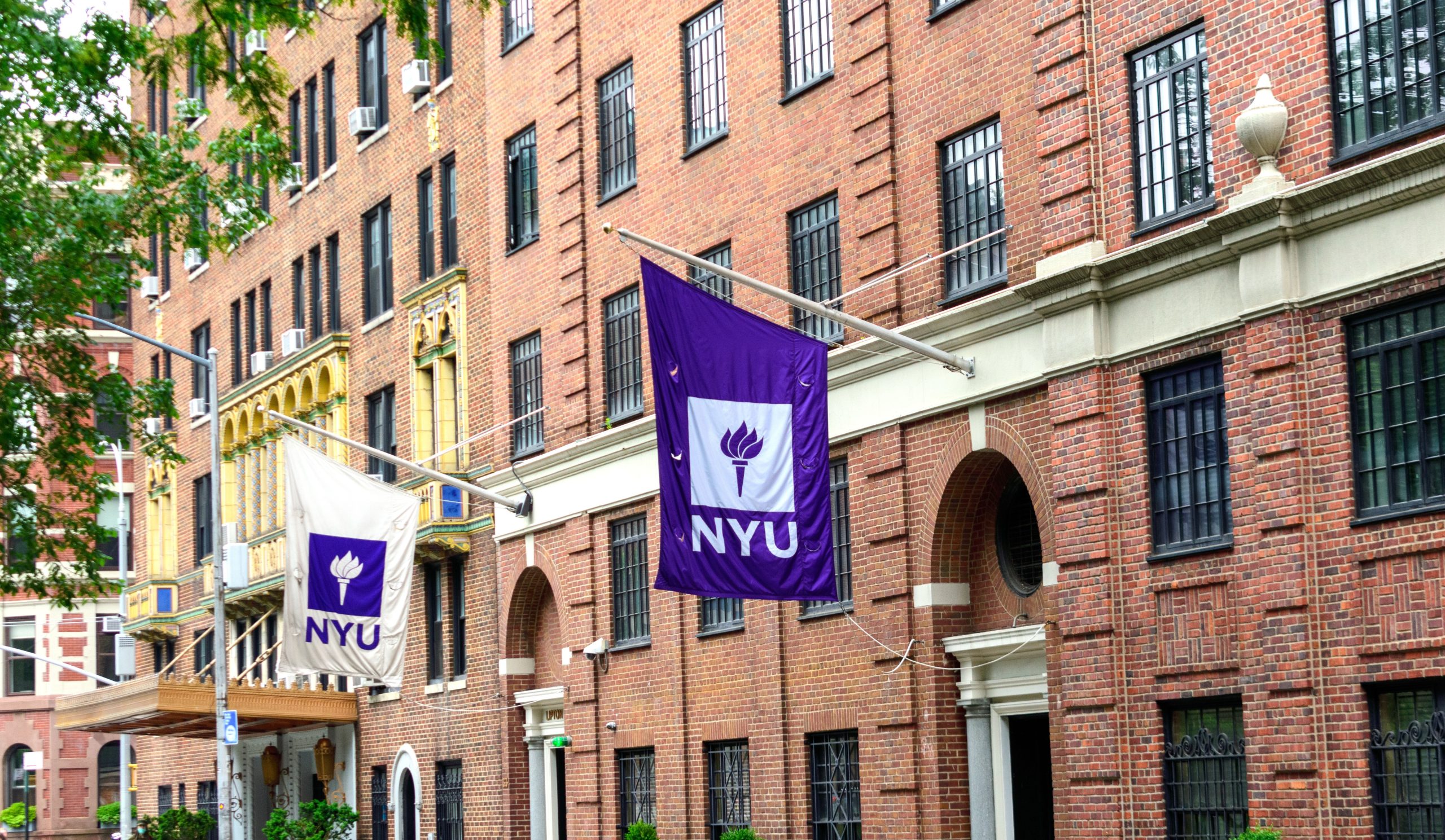 NYU banner on campus building of New York University - Manhattan, New - Nyu International Hospitality Industry Investment Conference