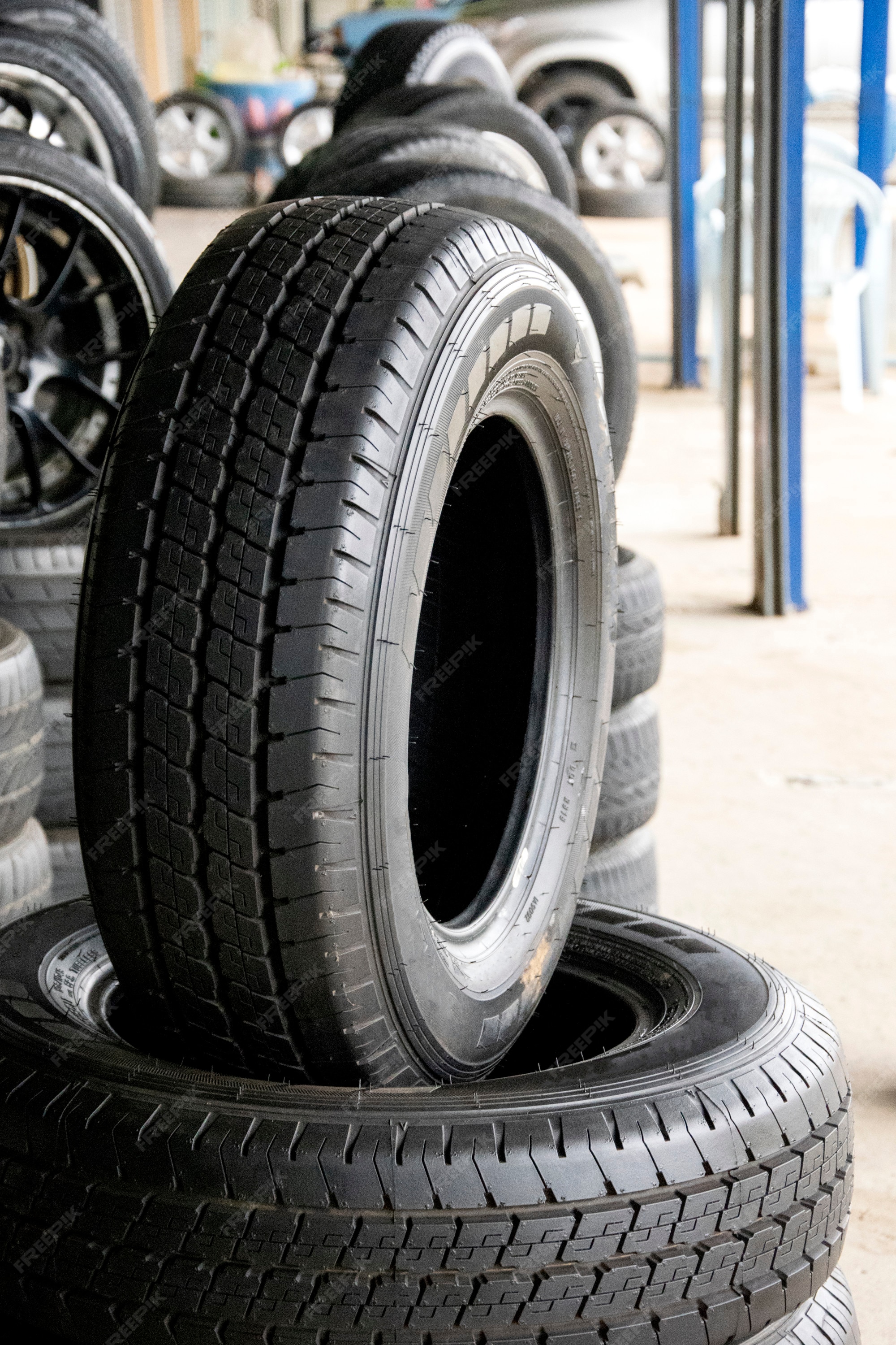 Premium Photo | Set of new modern tires in shop. Sale a tire in shop in - Tires For Sale On Black Friday