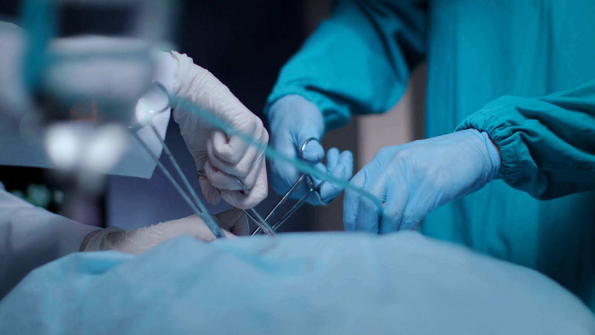 Surgeons operating process. Close up of surgical team performing - Operation Warm More Than A Coat
