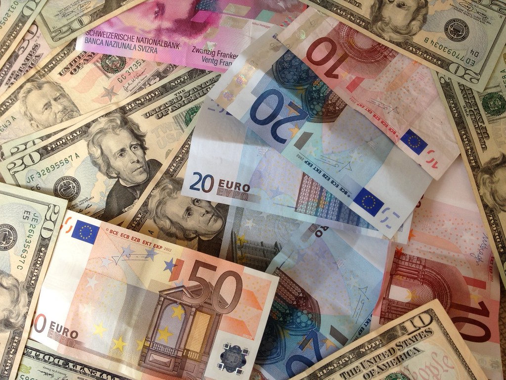 US dollars and Euros - cash banknotes | A stock photo of dol… | Flickr - How Much Is 8 Million Euros In Us Dollars